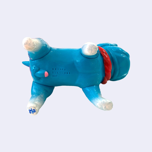 Underside of the Tosa Kenta dog figure, revealing male genitalia as well as an edition number on one of the feet.