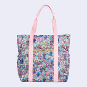 Large tote bag with additional pockets on the front and back. Features pastel pink colored fabric detailing, around the zipper and as the handles/straps. Bag has a small "tokidoki" nameplate on the upper center and is covered completely in a busy colorful pattern featuring tokidoki characters with with galactic and sci fi imagery.