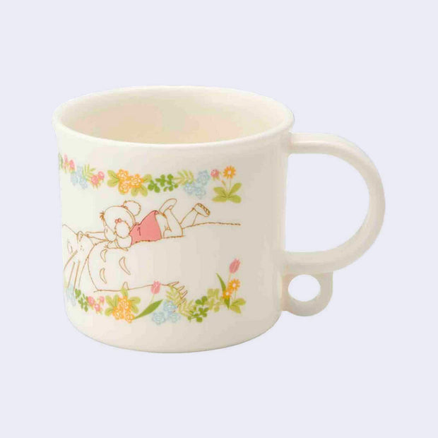 Short white plastic cup with a mug handle, featuring a vintage style illustration of Mei and Totoro from My Neighbor Totoro, where she lies atop his belly. They are framed by pastel florals.