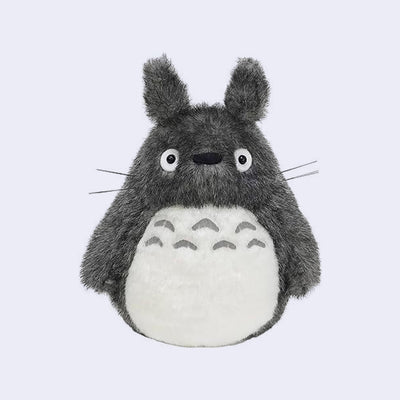 Dark gray Totoro plush, with a large white furry belly and whiskers.