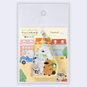 Keychain with cartoon characters holding a map, camera and travel backpack on a scenic background