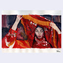 Artistic depiction of a woman with a red headscarf and jewelry, with 'Shin' signature.