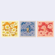 Right to left triptych of 3 square artworks, all of similar motifs. Top image is red monochrome of a character standing between many large camellia flowers. Middle is blue monochrome of a character standing in the middle of many large mum flowers. Last is yellow monochrome of a character standing in the middle of many large daisies with smiling faces.
