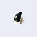 3D ceramic brooch/pin of a tuxedo cat's head, with a simple and cute cartoon smile , side view.