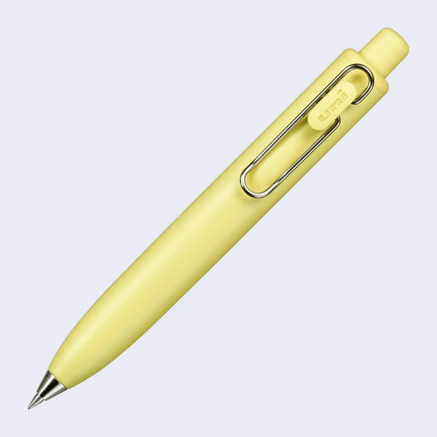 Thick, short banana yellow colored pen with a side clip and a silver pen opening.