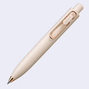 Beige (yogurt)  pen with gold accents on a light gray background