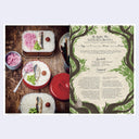 Bento box meal with a recipe card on a wooden surface