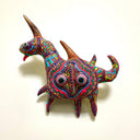 Colorful clay horse sculpture on a beige background