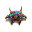 Colorful decorative bull head with intricate patterns on a white background
