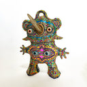 Colorful abstract creature figurine on a white background