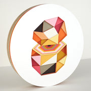 Geometric designed layered cut paper sculpture, creating a three dimensionality. A 10 sided shape is cut horizontally, revealing a hexagonal interior. Colors are orange, brown, yellow, pink and white.