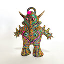 Colorful abstract figurine with geometric patterns on a white background