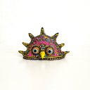 Colorful decorative mask with intricate patterns on a white background