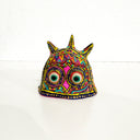 Colorful owl-shaped mask on a white background