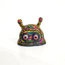 Colorful snail-shaped clay figurine on a white background
