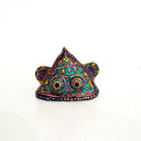Colorful decorative object with intricate patterns on a white background