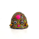 Colorful decorative object with intricate patterns on a white background