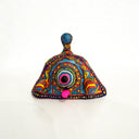 Colorful hand-painted clay object on a white background