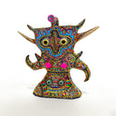 Colorful abstract sculpture with intricate patterns on a white background