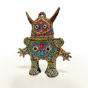 Colorful decorative figurine with intricate patterns on a white background