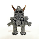 Black and white intricately patterned sculpture with intricate patterns on a white background