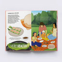 Illustrated book open to a page about summer rolls, showing a family eating outdoors.