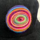 Black cap with a colorful spiral design on a white background