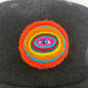 Black cap with a colorful spiral design on a white background