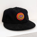 Black cap with a colorful circular design on a white background