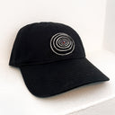Black cap with a circular design on a white background