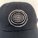 Black cap with a colorful spiral design on a white background