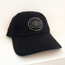 Black cap with a colorful spiral design on a white background
