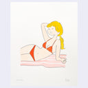 Illustration of a cartoon woman lounging in a red bikini on a pink beach towel. She has long blonde hair in a ponytail and yawns.
