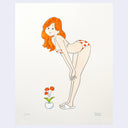 Cartoon-style illustration of a woman with red hair and a swimsuit, leaning forward with her hands on her knees in front of a small vase of flowers.