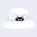 White bucket hat with a black robot face design on a white background