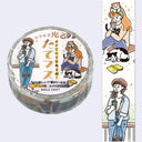 A roll of decorative washi tape shown on a light gray background, alongside a vertical strip of matching illustrated tape featuring cartoon women, cats, and small yellow items. The main roll has Japanese text and the visible brand WORLD CRAFT.