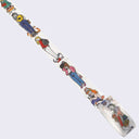 An unrolled roll of washi tape with vertically printed designs of girls dressed fashionably with cats around them.
