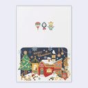 A Christmas-themed greeting card featuring a festive winter village scene with houses, a Christmas tree, ornaments, snowflakes, and the words “Merry Christmas” on a dark blue panel. The card has a white border and is shown against a light gray background.