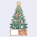A Christmas-themed greeting card shaped like a decorated tree, with a gold star on top, colorful ornaments, a brick base, and a blank white writing panel at the bottom.