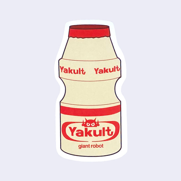 Die cut sticker of a small red capped bottle of Yakult, with a small robot head as the logo instead and "giant robot" written below the main logo.