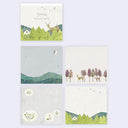 A set of four square memo pad pages arranged in a 2x2 grid on a light gray background. Each print features a minimalist, watercolor-style nature scene with green trees, hills, deer, birds, and small houses.