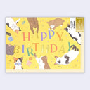 Birthday greeting card with illustrations of cats playing with various household items.