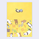 Birthday card with cartoon cats and 'Happy Birthday' text on a yellow background