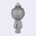 Translucent gray sculpture of a cratered moon with a simplistic, closed eye smiling face. It wears a bowler hat and a suit, arms at its side, with painted silver dots on the hat and suit. Sculpture is reminiscent of Magritte. Signed by Yoskay Yamamoto on the back.