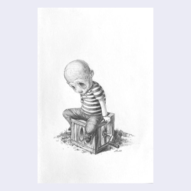 Pencil drawing on white paper of a kid with a skull head, sitting on a closed wooden box with a crank.