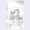 Ink drawing on spiral bound sketchbook paper of a woman's torso. She has mid length hair and wears a t-shirt, holding a mask of a one eyed cat.