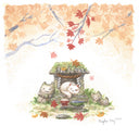 Watercolor painting of an autumn scene with orange and red leafed trees at the top of the piece, over a small stone shrine that has been overgrown with moss and greenery. Stone cat heads are around it and a white cat sleeps happily in the center, in front of a plate of fish and rice offering.
