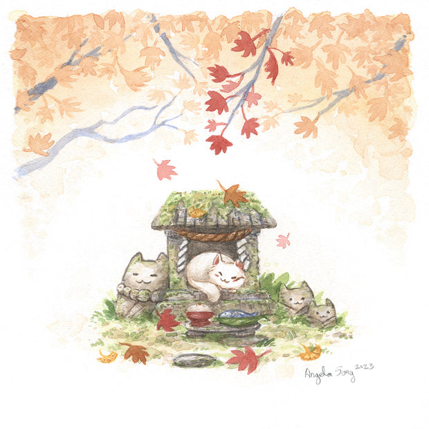 Watercolor painting of an autumn scene with orange and red leafed trees at the top of the piece, over a small stone shrine that has been overgrown with moss and greenery. Stone cat heads are around it and a white cat sleeps happily in the center, in front of a plate of fish and rice offering.