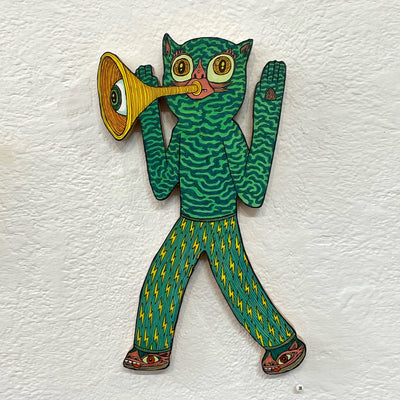 Illustrated wood cut of a bright green cat-like monster with wavy patterned fur, playing a trumpet with an eyeball that comes out of it.