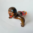 Clay figure of a man doing a push up, looking very tired despite having a very fit body.